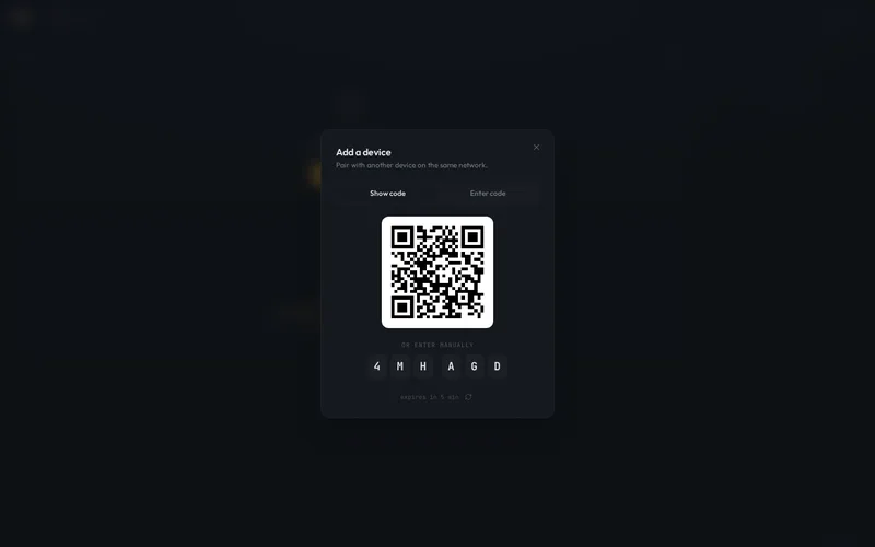 D2D's device pairing modal, showing a QR code and one-time manual entry code